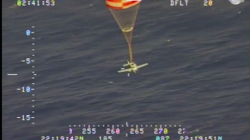 a plane flying with a parachute