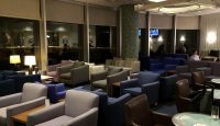 a room with many chairs and tables