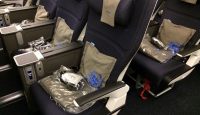 a row of seats with a bag on it