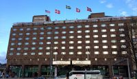 a building with many flags on top