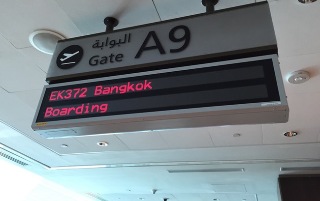 a sign with red and black text