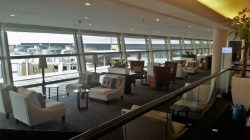 a room with many chairs and tables
