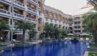 a swimming pool in front of a building