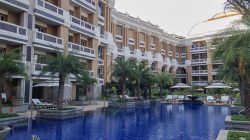 a swimming pool in front of a building