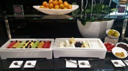 a plate of fruit and cheese on a table