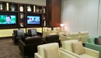 a room with couches and a tv