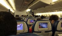 a group of people sitting in an airplane