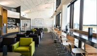 a room with chairs and tables