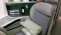 a seat with a pillow and a digital display