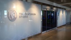 a building with glass doors and a sign