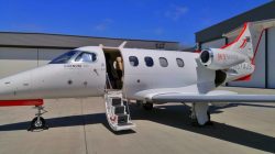 a white airplane with a ladder
