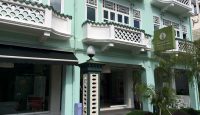 a building with a green and white building