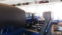 a group of people sitting in an airplane