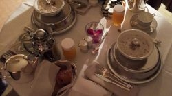 a table with silverware and food on it