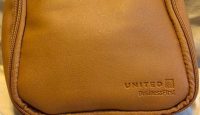 a brown bag with zippers