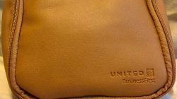 a brown bag with zippers