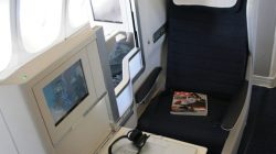 a laptop on a chair in an airplane