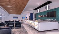a room with a bar and chairs