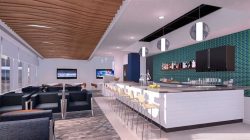 a room with a bar and chairs