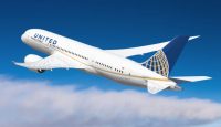 a white airplane in the sky