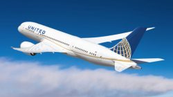 a white airplane in the sky