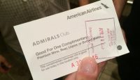 a hand holding a ticket