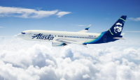 a white airplane in the sky