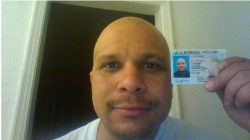 a man with a id card on his forehead