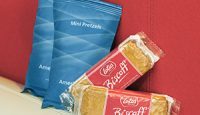several packages of food on a couch
