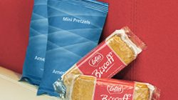 several packages of food on a couch