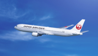 a white airplane in the sky