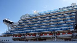 a large cruise ship with many boats on deck