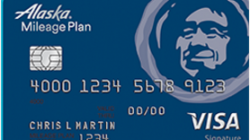 a blue credit card with a picture of a man