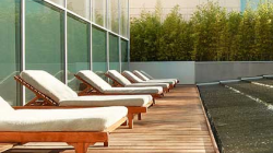 a row of lounge chairs on a deck