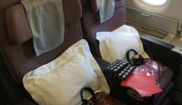 a seat with headphones and a bag on it