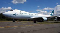 a large white airplane on a runway