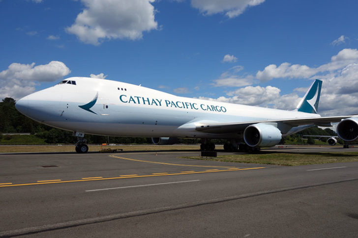 a large white airplane on a runway