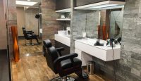 a room with a mirror and chairs