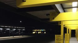 a yellow signs on a parking lot
