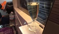 a glass of champagne on a window sill