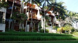 a building with trees and plants
