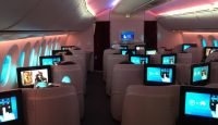 a row of seats with monitors on them