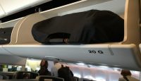 a black bag on top of an airplane