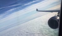an airplane wing and clouds