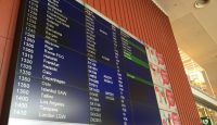 a screen with a sign on the wall