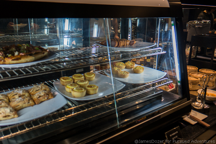 food on plates in a display case