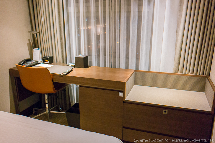 a desk with a chair in a room