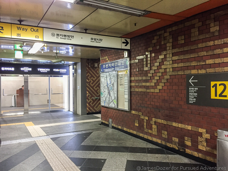 a brick wall with a sign on it