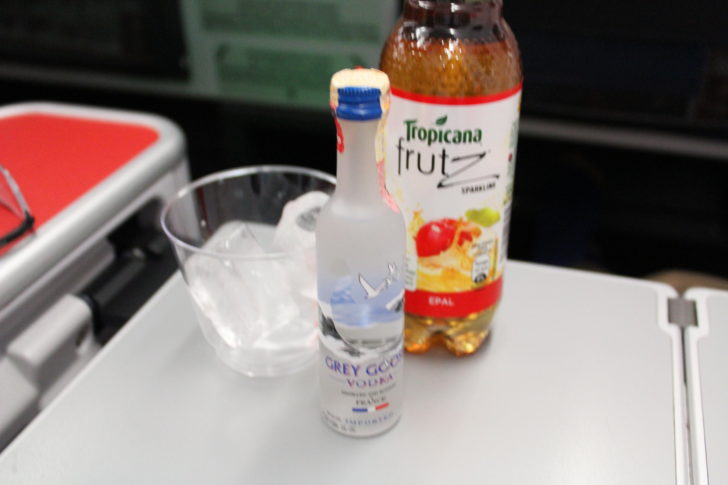 a bottle of vodka and a glass of ice on a table