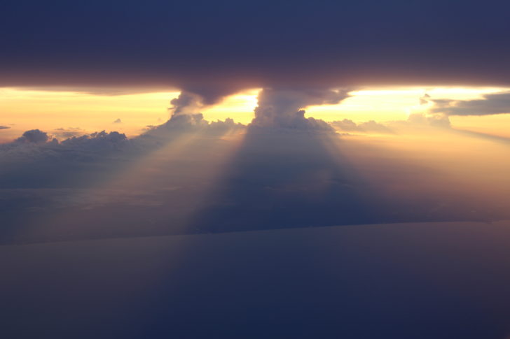 sun shining through clouds